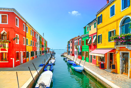 Fototapeta Venice landmark, Burano island canal, colorful houses and boats,