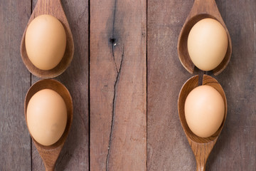 Eggs  on a Wooden kitchenware.and wood background