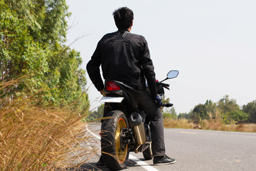 Biker man sit on motorcycle