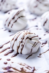 Fresh meringue decorated with chocolate