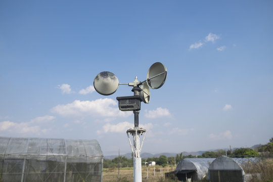 Anemometer in a farm with blue sky