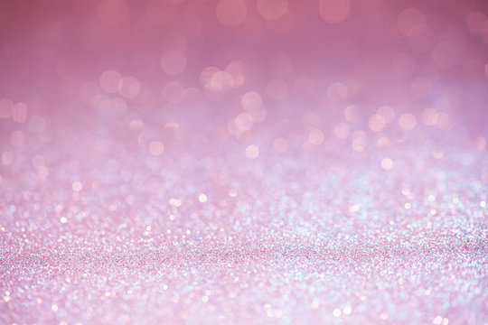 Pink glitter surface with pink light bokeh