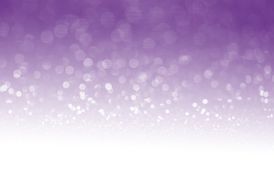 Purple glitter surface with purple light bokeh with white empty copyspace