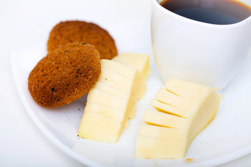 cup of coffee with chease and oat cookies
