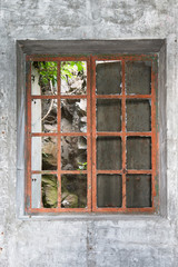 Window with metal bars in abandoned building