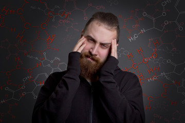 man with a beard is suffering from drug addiction