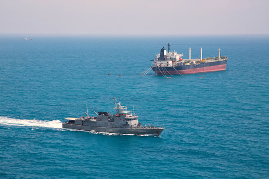 oil tanker near battle ship