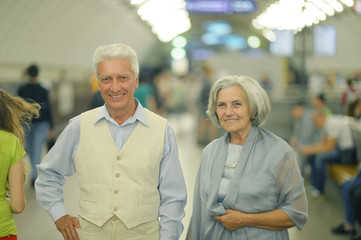 beautiful elderly couple in subway