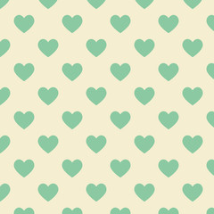 Seamless polka dot yellow pattern with green heart