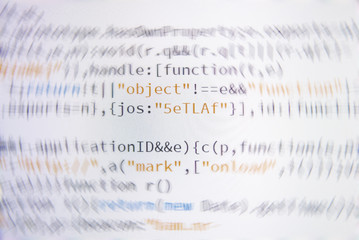 Software developer programming code. Abstract computer script code. Shallow depth of field,...