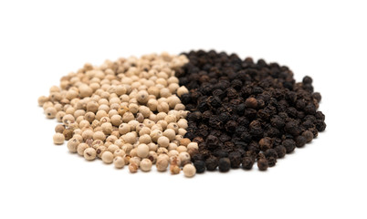 Pile of white and black pepper
