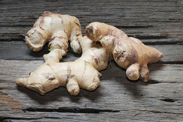 Fototapeta premium Ginger root on the wooden background