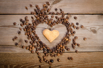Frame- heart from coffee beans and cookies-heart  inside it on