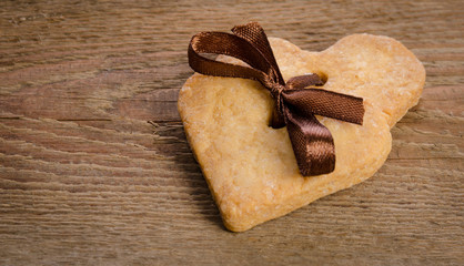  cookies-hearts related together on  wooden table