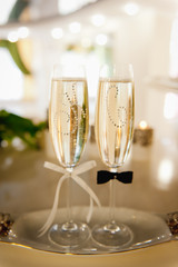 Wedding glasses filled with champagne at the banquet