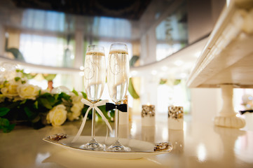 Wedding glasses filled with champagne at the banquet