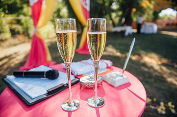 Wedding glasses filled with champagne at the banquet