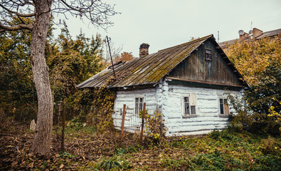 Fototapeta na wymiar The thrown old wooden house 