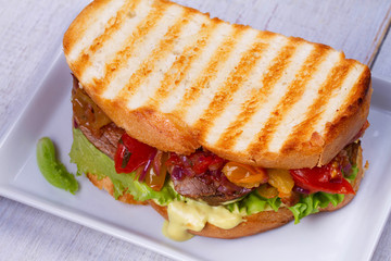 Beef Sandwich with Tomatoes, Coriander, Red Onion and Green Salad