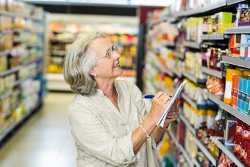 Senior woman checking list