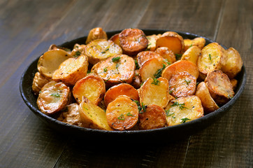 Fried potatoes in a frying pan