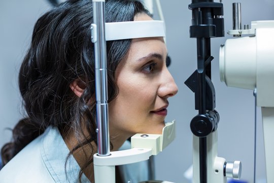  Female patient being examined by optician
