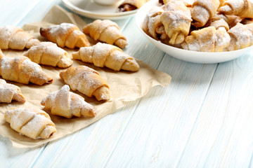 Fresh homemade croissants on a blue wooden table