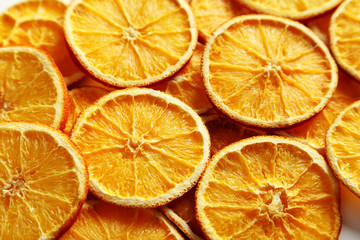 Fototapeta na wymiar Dried orange slices background, close up