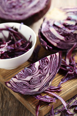 Ripe red cabbage on a grey wooden table