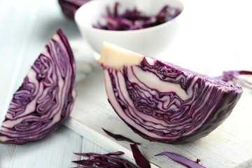 Ripe red cabbage on a blue wooden table