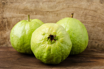 Fresh guava (tropical fruit) on wooden background
