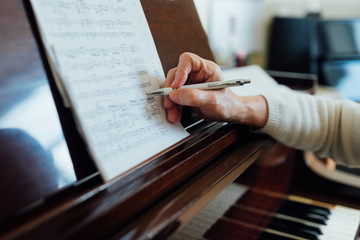 writing notes on sheet music