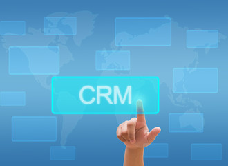 hand touching CRM or Customer Relationship Management on virtual screen interface