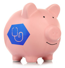 Pink ceramic piggy bank isolated on white