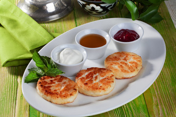 homemade cheesecakes with sour cream and jam still life wooden table green beautiful board appetizing