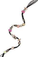 Modern fashion jewellery with charms and pendants on white background