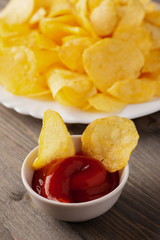 Plate of crispy chips and red sauce