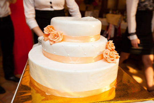 White Wedding Cake With Orange Details