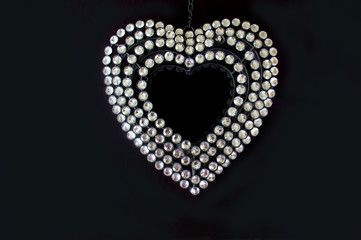 Diamante heart on black background