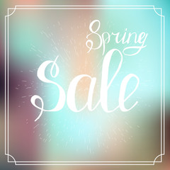Typographic Design. Lettering Spring design on blurred background