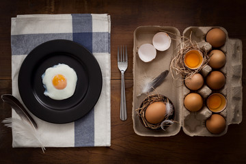 eating fried eggs flat lay still life rustic with food stylish
