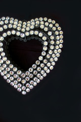 Diamante heart on black background
