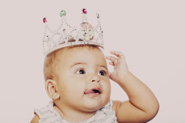 Close-up of little girl wearing fancy crown