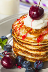 Stack of pancakes with fresh berries