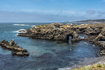 Fototapeta na wymiar Natural arc along Mendocino coast, California