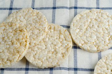 rice cake, puffed rice on table cloth.