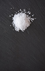 coarse salt on a black slate table