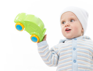 little child baby boy playing with car