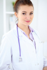 Portrait of young female  doctor in a hospital