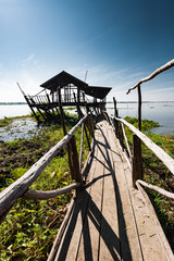 Wooden hut, lake, landscape. Udon Thani, Thailand.